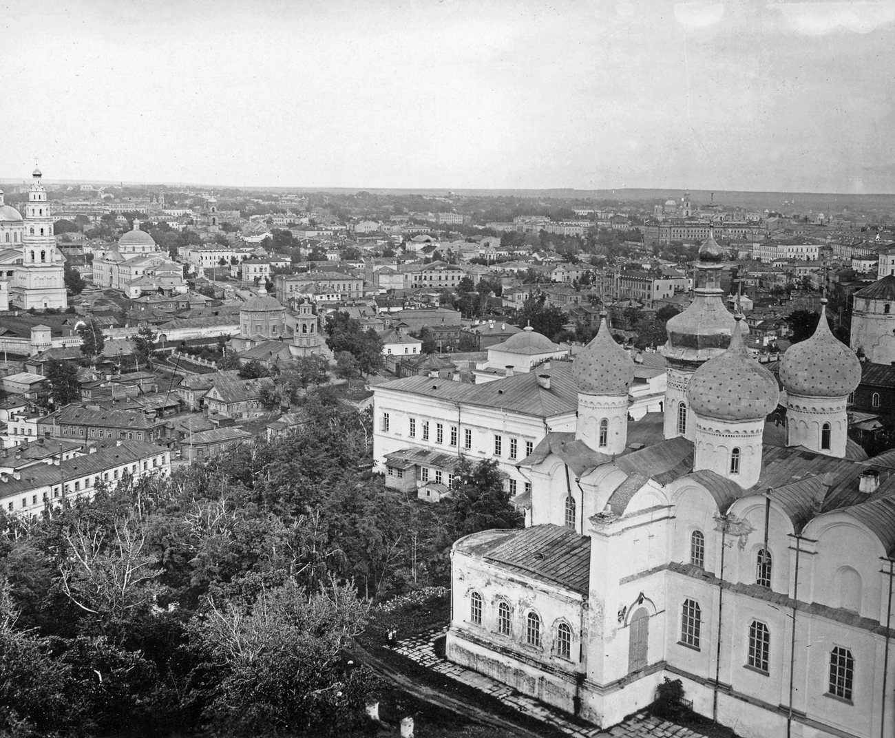 Kazan's rooftops and churches running to the horizon beyond the domes of the Annunciation Cathedral in the kremlin, seen from the Söyembikä Tower in 1900