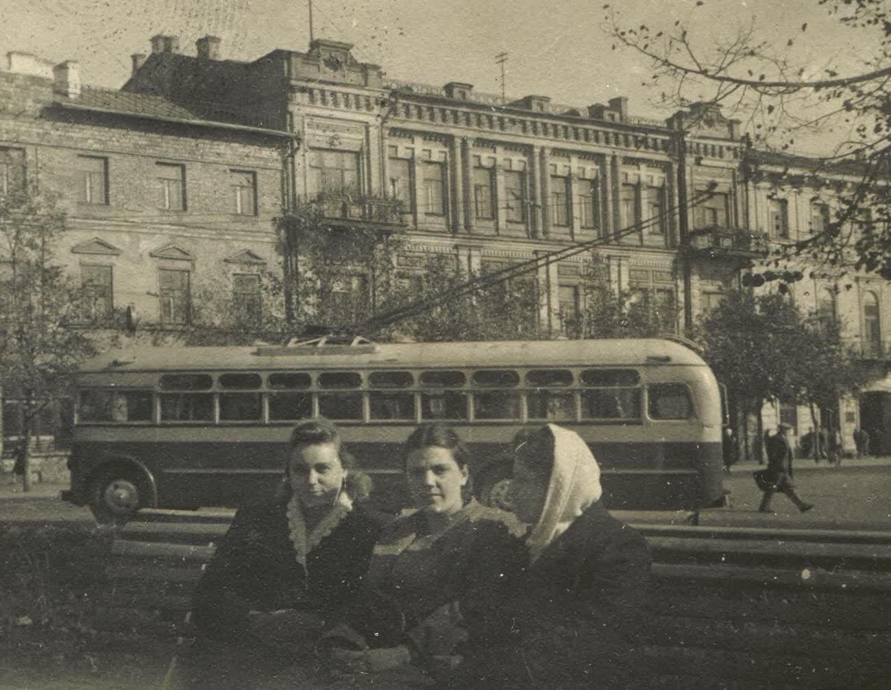 Three young women in front of a trolleybus on Kalinin Square in Kyiv in 1950