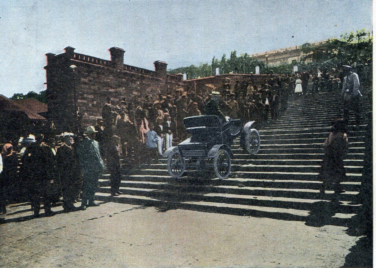 A crowd watching an Oldsmobile climb the Boulevard Stairs, today the Potemkin Stairs, in Odesa around 1904
