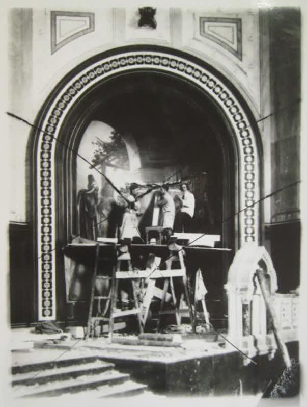 Workers on scaffolding dismantling a painting inside the Cathedral of Christ the Saviour in 1931