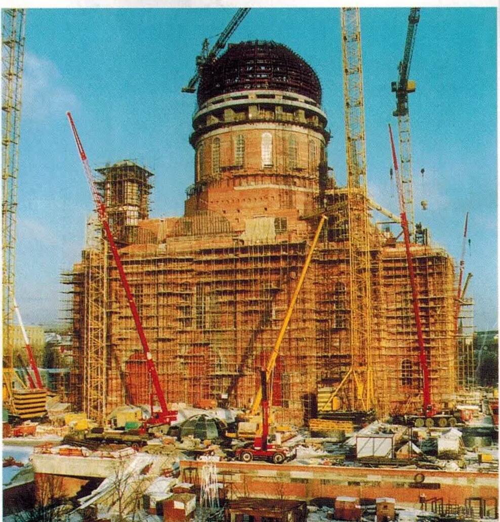 The Cathedral of Christ the Saviour under reconstruction in 1995, its dome rising amid scaffolding and cranes