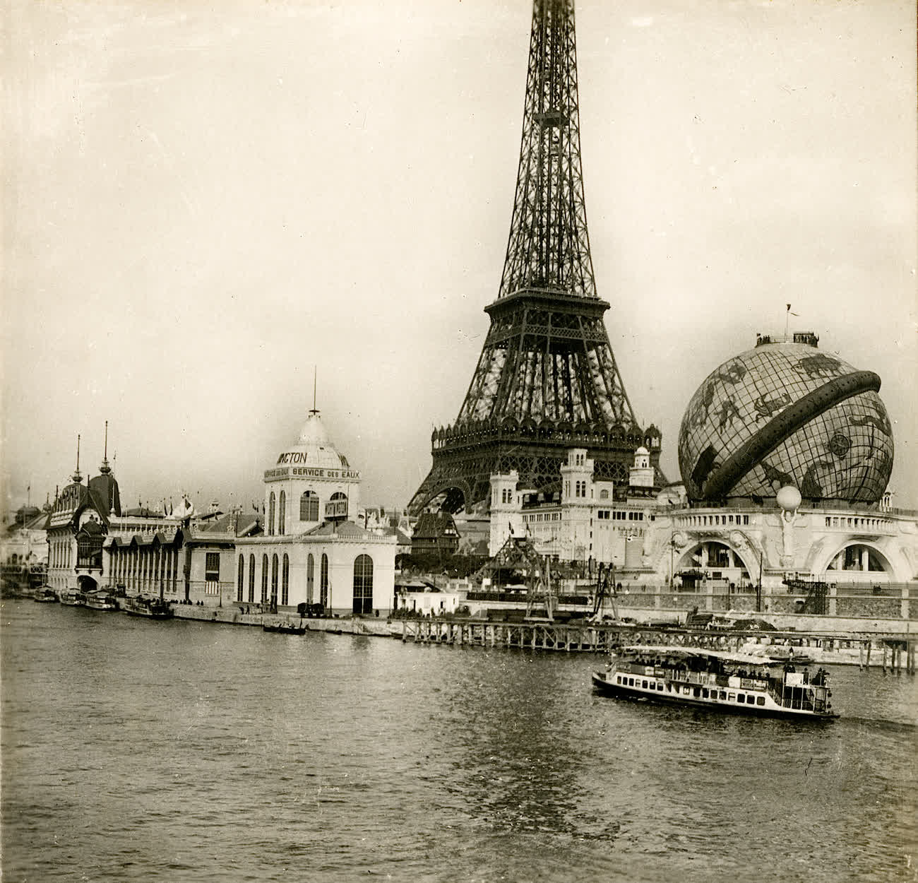 The Eiffel Tower beside the giant Globe Céleste at the 1900 Exposition Universelle in Paris