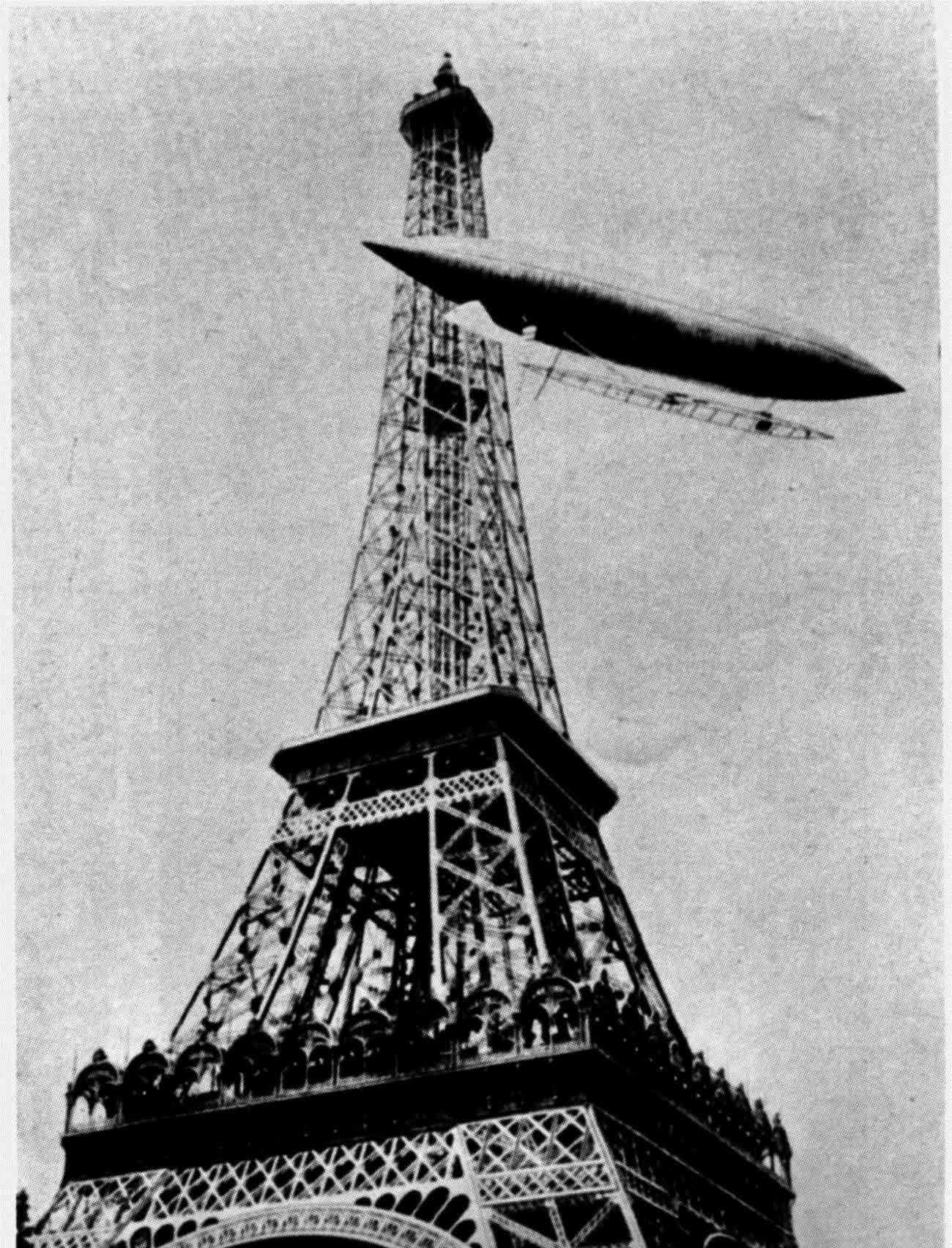 Alberto Santos-Dumont's airship flying past the top of the Eiffel Tower, 1901