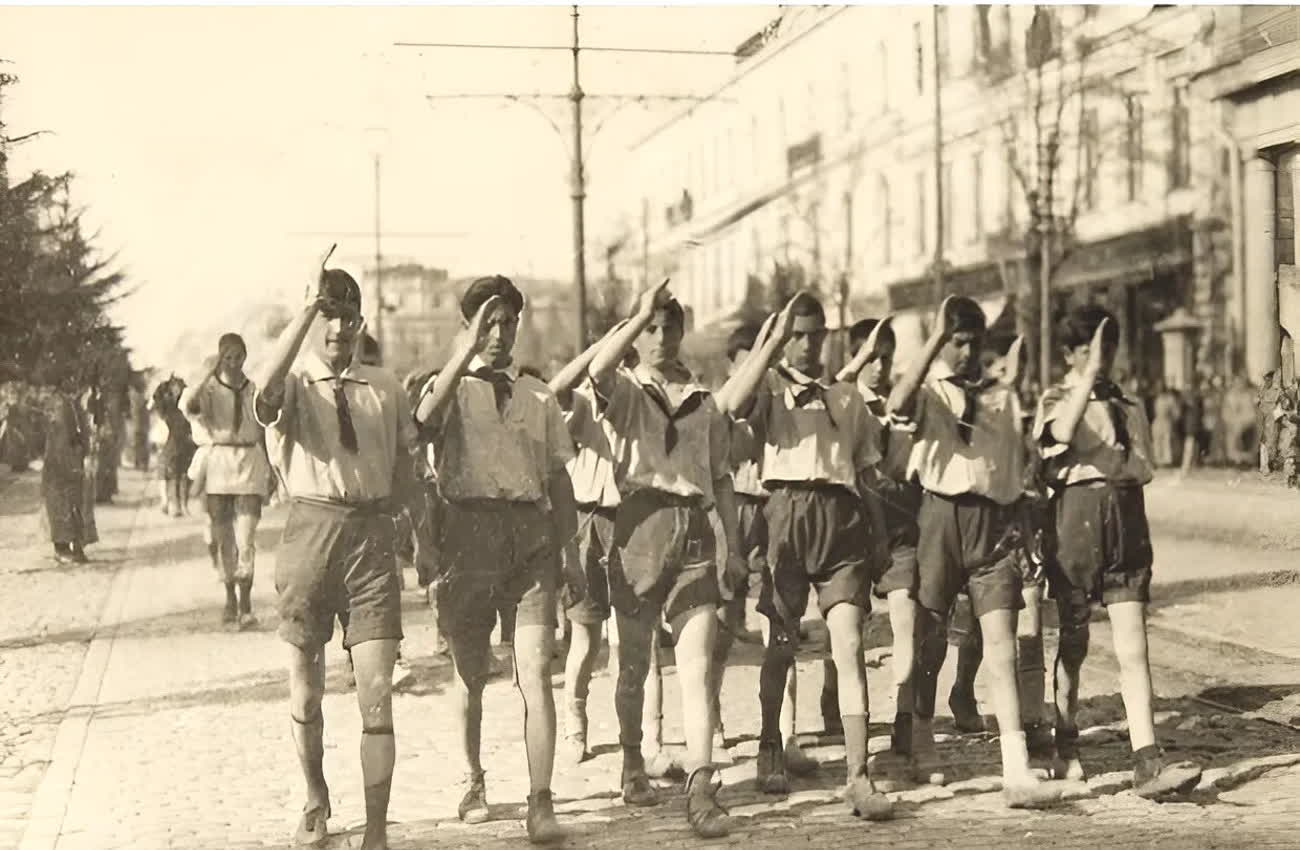 Young Pioneers marching and saluting on Rustaveli Avenue, Tbilisi, around 1930