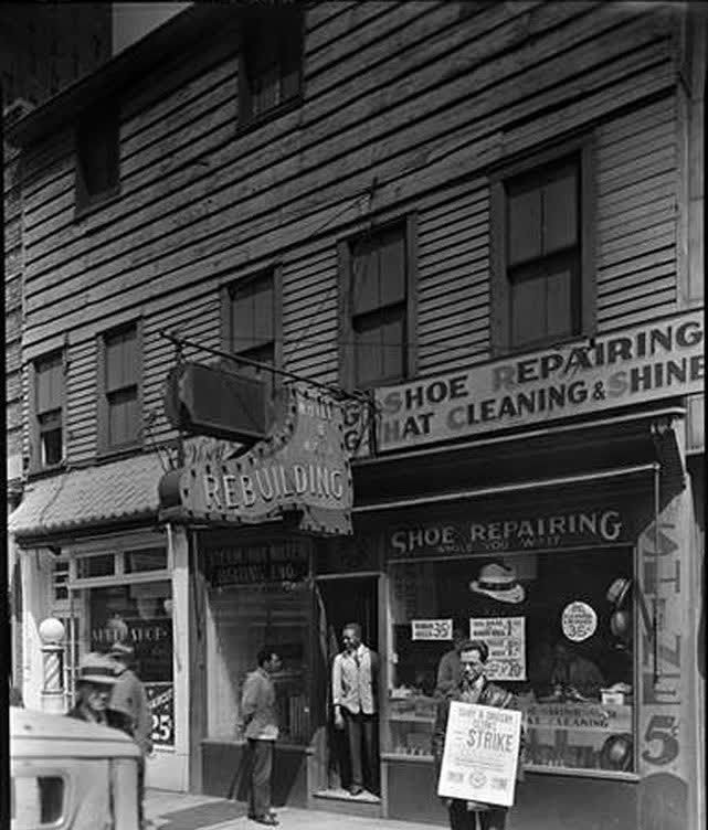 A shoe-repair and hat-cleaning storefront on Vesey Street, Lower Manhattan, 1938