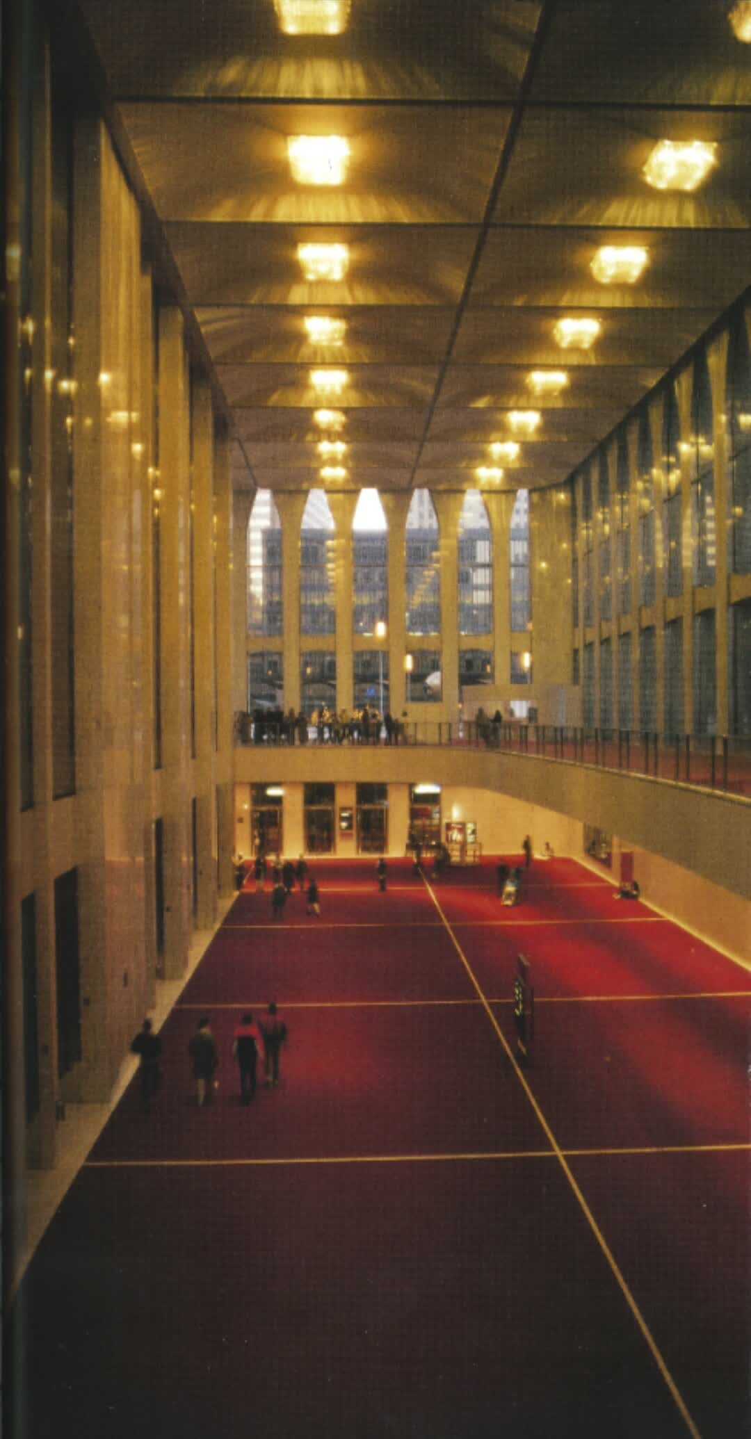 The soaring glass-and-steel lobby of a World Trade Center tower in 1988, with tall narrow gothic arches